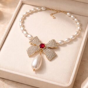 Elegant Pearl and Gold Bow Necklace